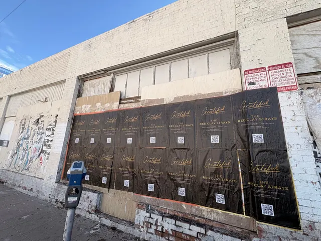 Red Clay Strays wheatpaste show poster in downtown Phoenix by Beyond Street Media (photo 11 of 24).