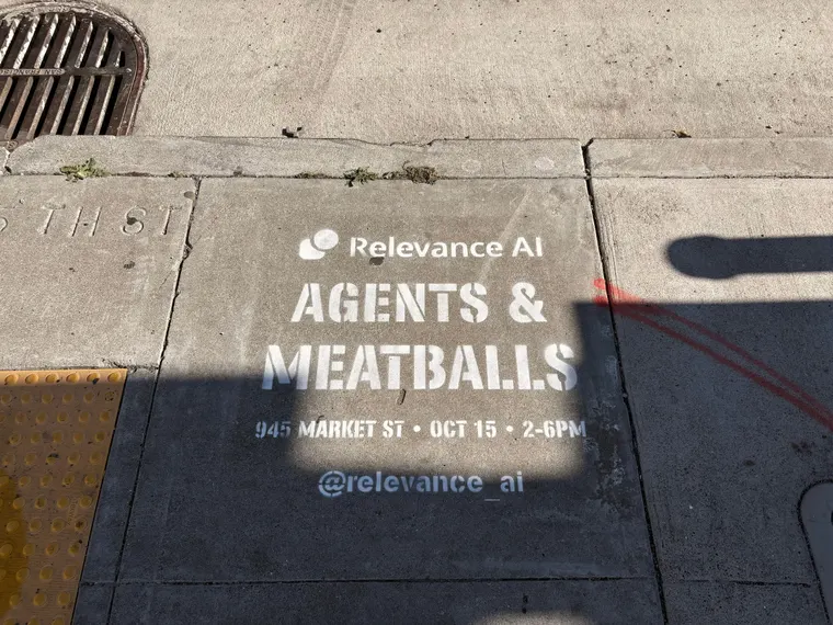 Relevance AI 'Agents & Meatballs' event sidewalk stencil on a San Francisco sidewalk, CA by Beyond Street Media
