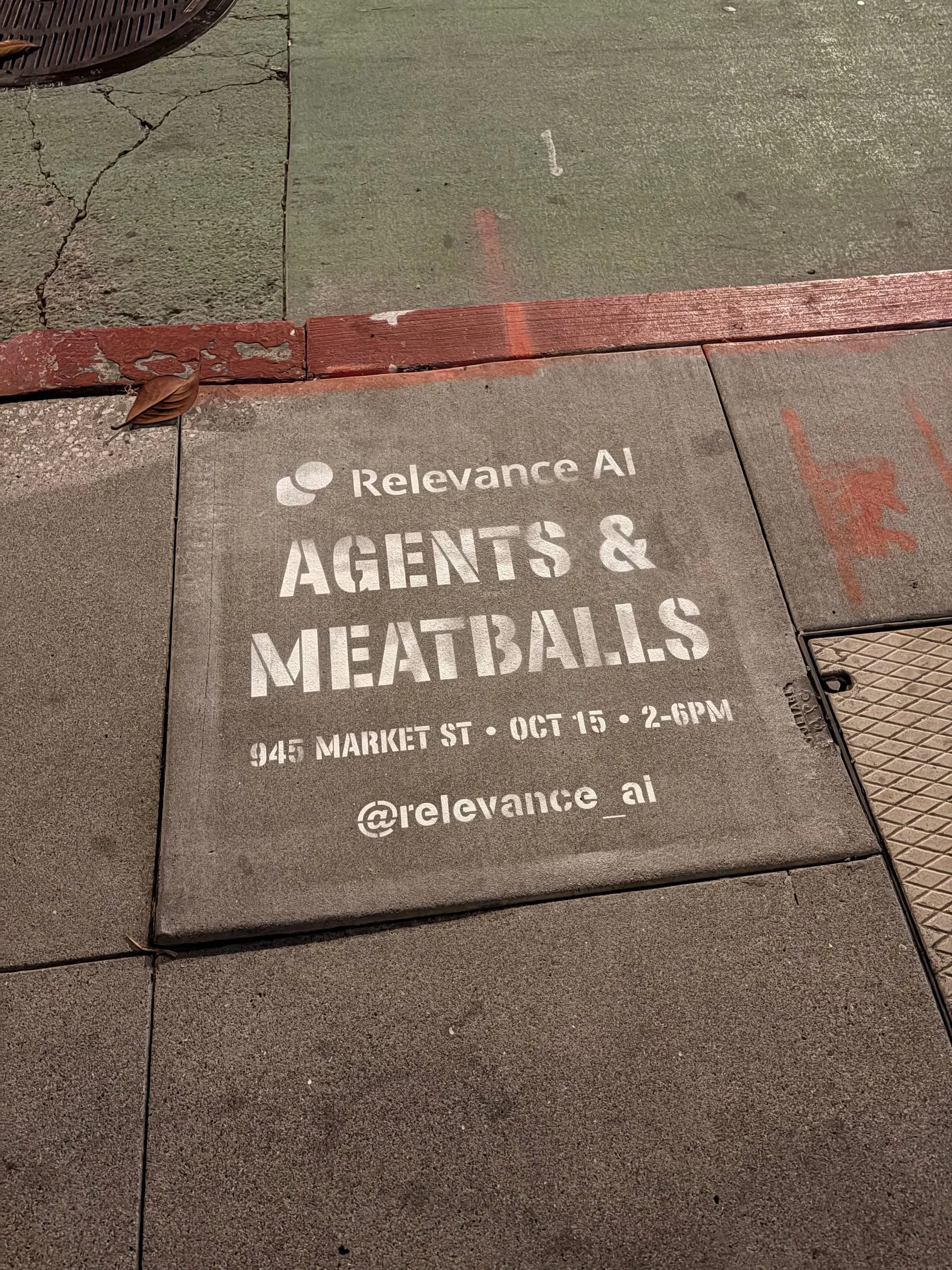 Relevance AI 'Agents & Meatballs' event sidewalk stencil on a San Francisco sidewalk, CA by Beyond Street Media