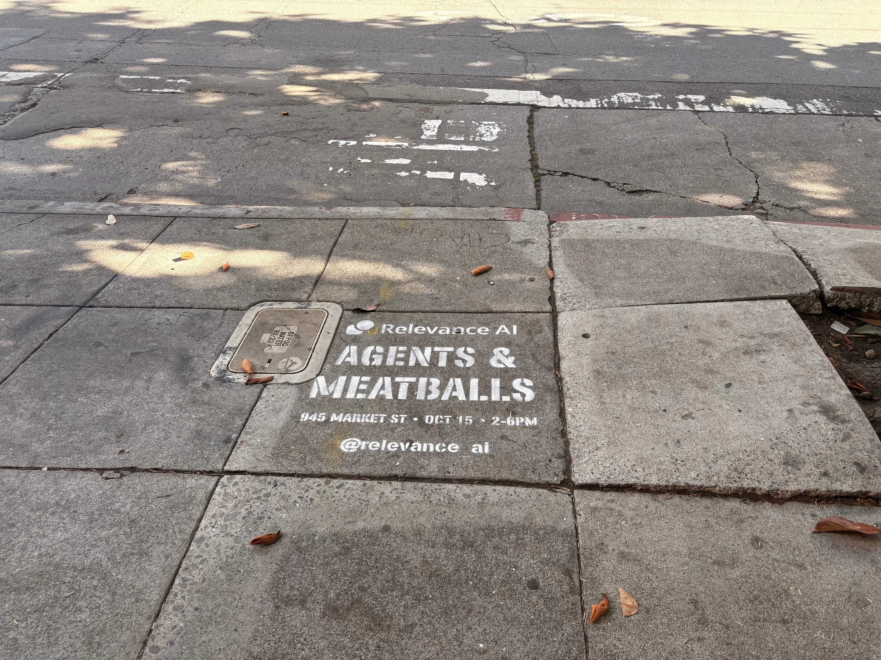 Relevance AI 'Agents & Meatballs' event sidewalk stencil on a San Francisco sidewalk, CA by Beyond Street Media
