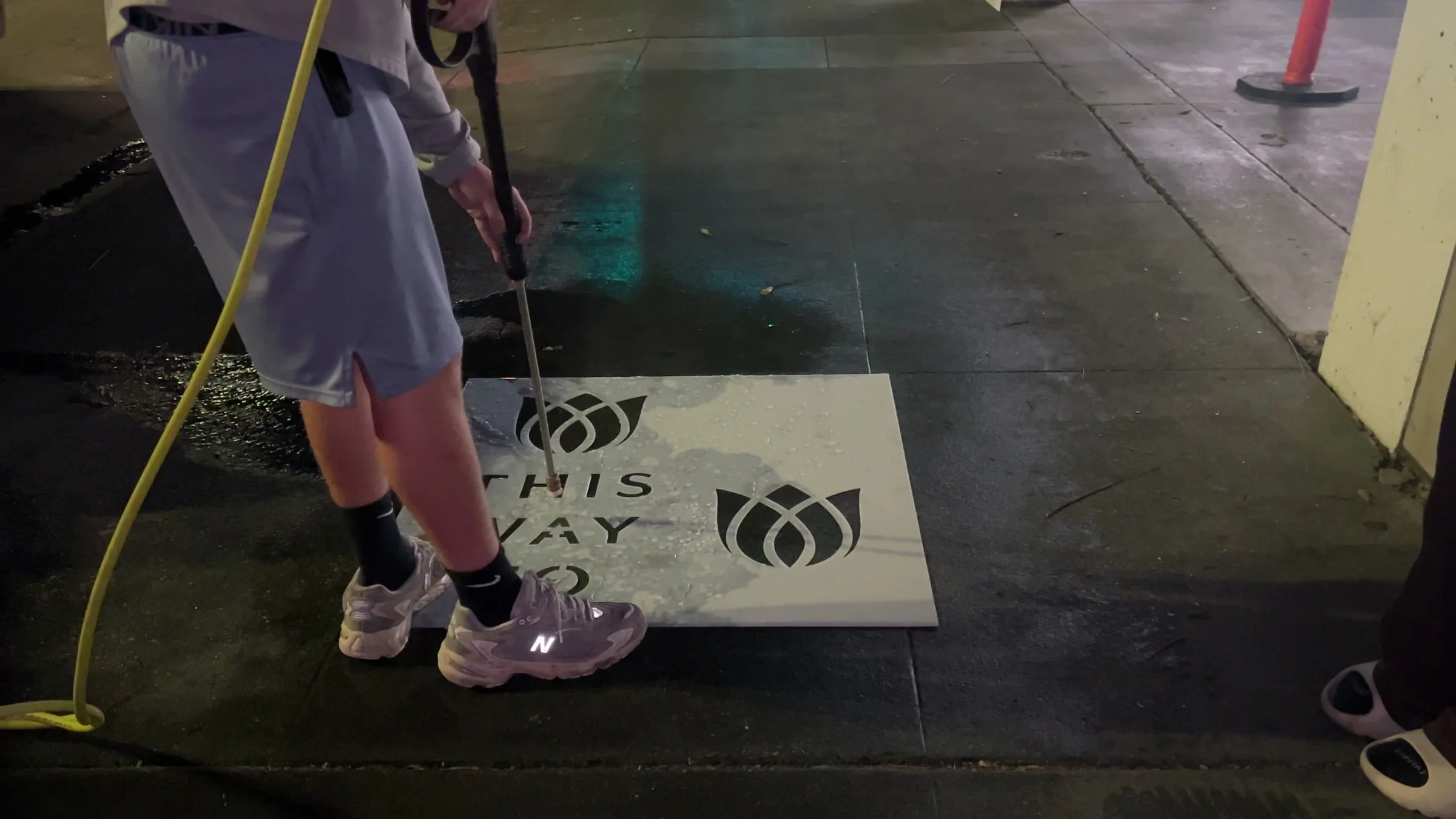 Reverse stencil clean-tag install for Bloomeffects 'Tulip Powered Skincare' on New York City sidewalk in New York City: pressure-washed logo revealed in clean concrete by Beyond Street Media. No paint, no chalk, no ink, only the absence of grime.