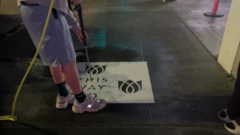 Reverse stencil clean-tag install for Bloomeffects 'Tulip Powered Skincare' on New York City sidewalk in New York City: pressure-washed logo revealed in clean concrete by Beyond Street Media. No paint, no chalk, no ink, only the absence of grime (photo 1 of 4).