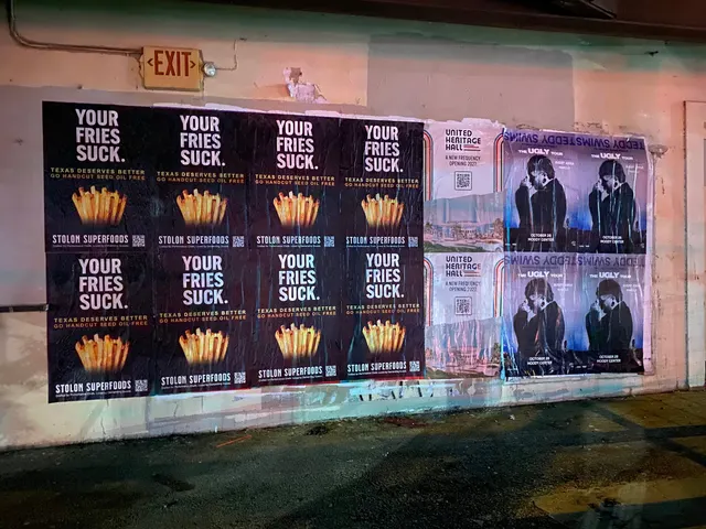 Stolon Superfoods wheatpaste posters, eight in two rows of four, under a red EXIT sign by Auditorium Shores, at night