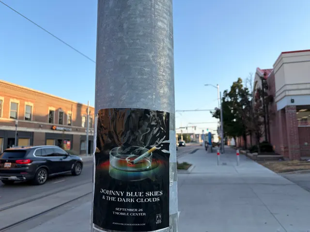 Johnny Blue Skies ashtray poster on a galvanized pole at West 38th Street, Westport, streetcar tracks at sunset