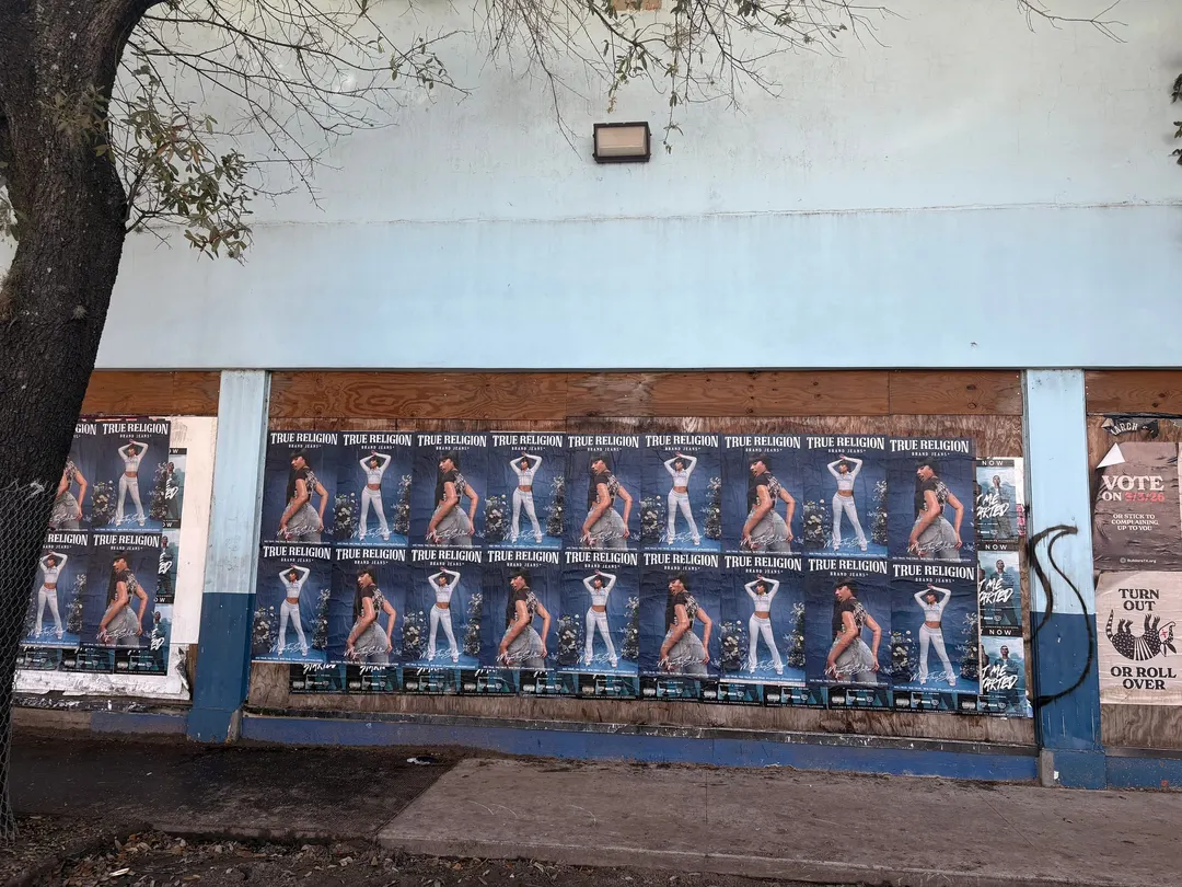 True Religion wheatpaste run the length of a Houston wall by Beyond Street Media.