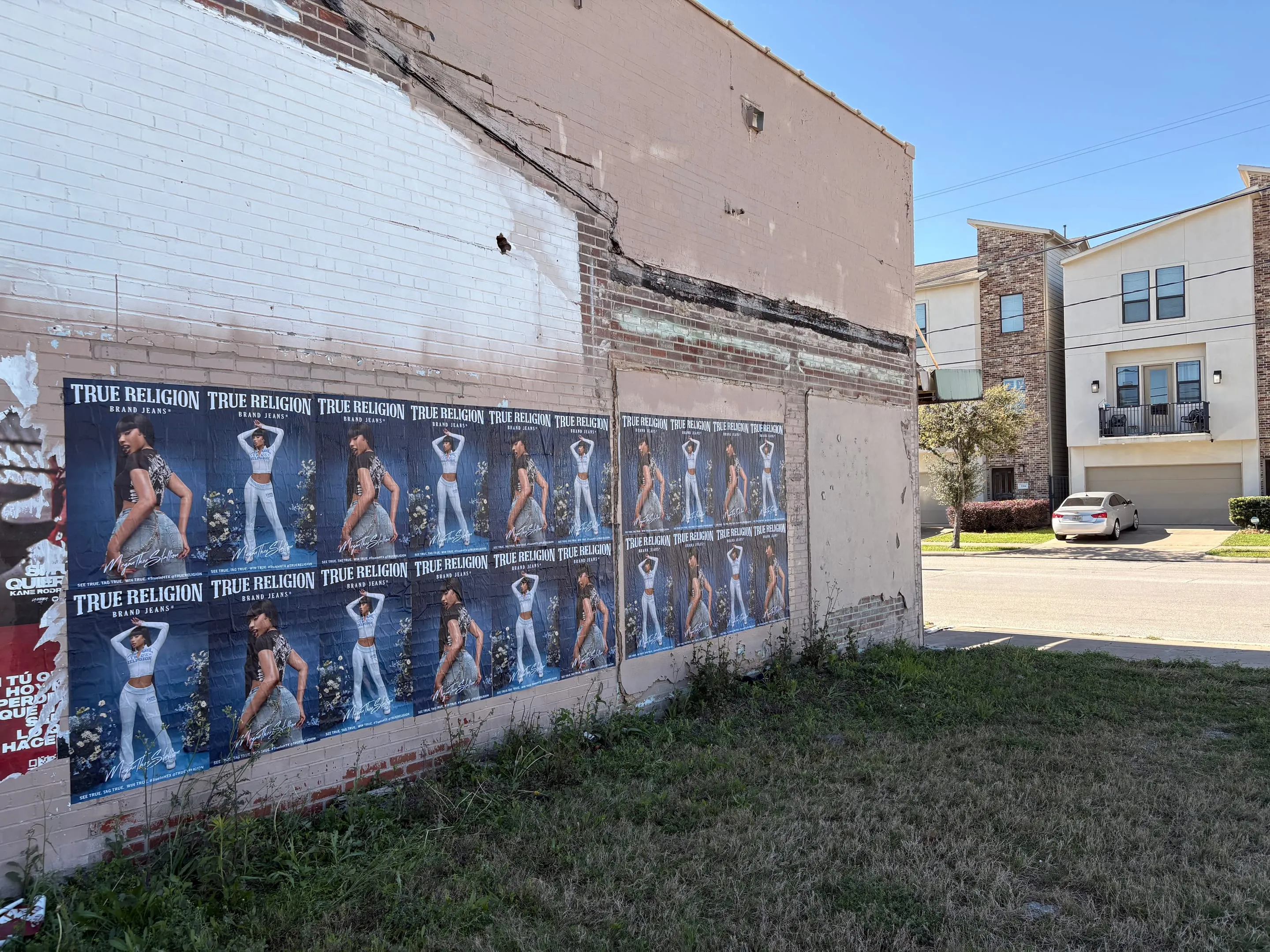 True Religion wheatpaste posters on a consented Houston wall by Beyond Street Media