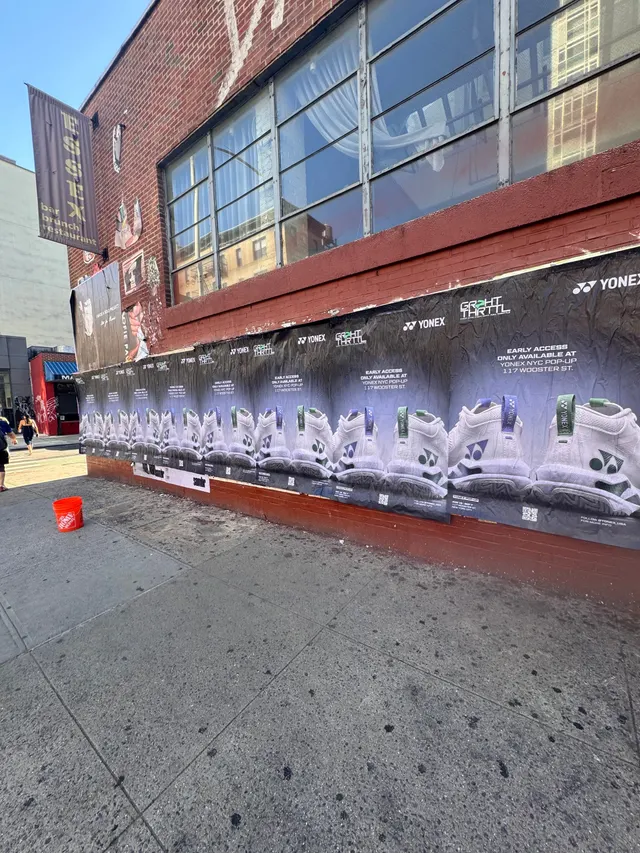 Yonex Pop-Up sidewalk stencil at 117 Wooster St, SoHo NYC - neon-green spray stencil by Beyond Street Media (photo 9 of 28).