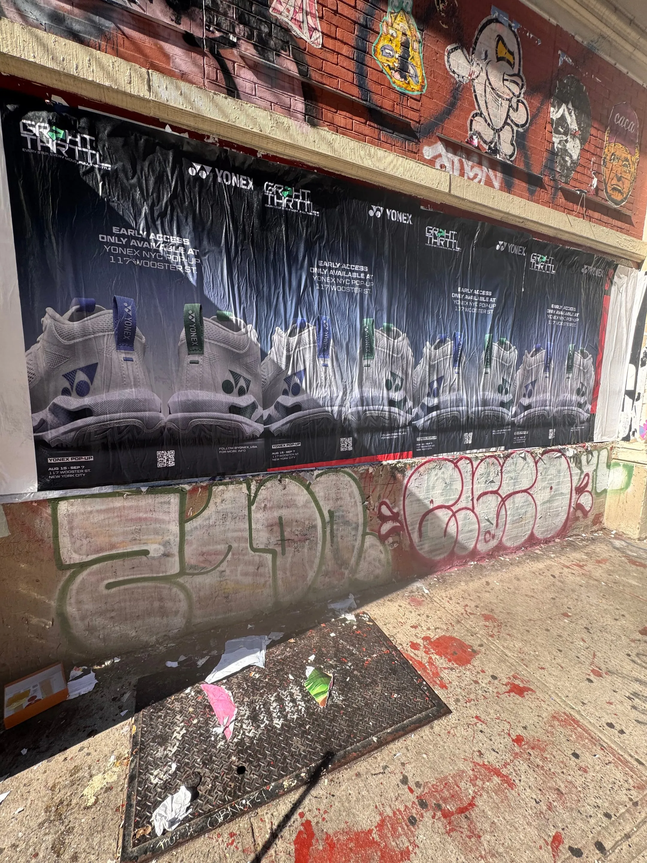 Yonex Pop-Up sidewalk stencil at 117 Wooster St, SoHo NYC — neon-green spray stencil by Beyond Street Media