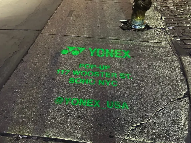 Yonex Pop-Up sidewalk stencil at 117 Wooster St, SoHo NYC - neon-green spray stencil by Beyond Street Media (photo 6 of 28).