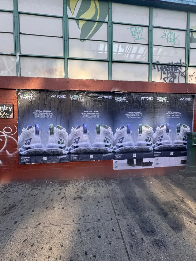 Yonex Pop-Up sidewalk stencil at 117 Wooster St, SoHo NYC - neon-green spray stencil by Beyond Street Media (photo 16 of 28).
